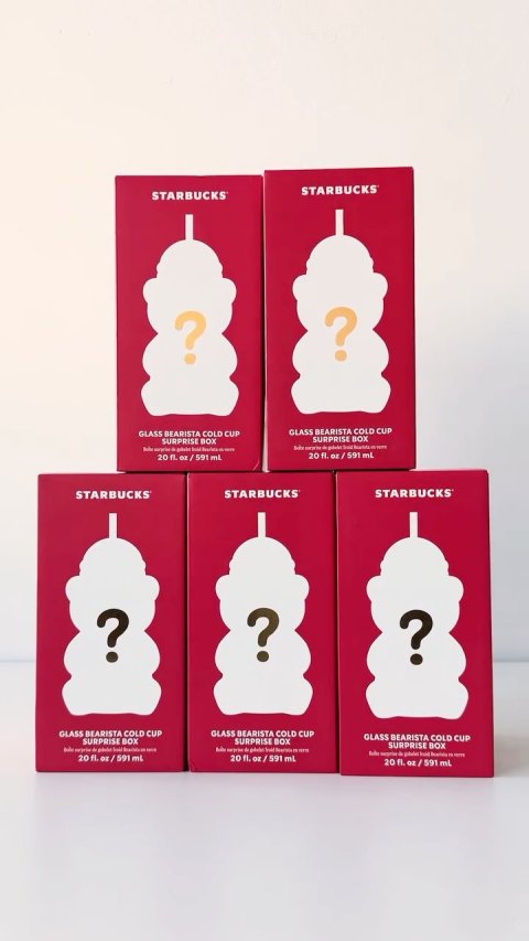 Text, Symbol, Business Card. Text: STARBUCKS STARBUCKS ? ? GLASS BEARISTA COLD CUP GLASS BEARISTA COLD CUP SURPRISE BOX SURPRISE BOX 20 fl. oz/591 mL STARBUCKS STARBUCKS STARBUCKS ? ? ? GLASS BEARISTA COLD CUP GLASS BEARISTA COLD CUP GLASS BEARISTA COLD CUP SURPRISE BOX SURPRISE BOX SURPRISE BOX 20 fl. oz/591 ml
