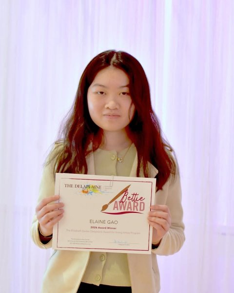 Person, Portrait, Smile. Text: Bettie AWARD ELAINE GAO