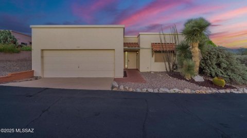 Garage, Indoors, Tree. Text: ©2025 MLSSAZ