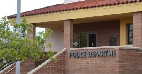 Brick, School, City. Text: POLICE DEPARTME