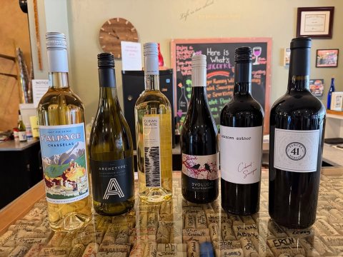 Bottle, Alcohol, Beverage. Text: Here is What's - A ERIN