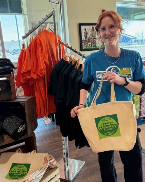 Handbag, T-Shirt, Person. Text: CON COMMON MARKET MARKET CO+OP