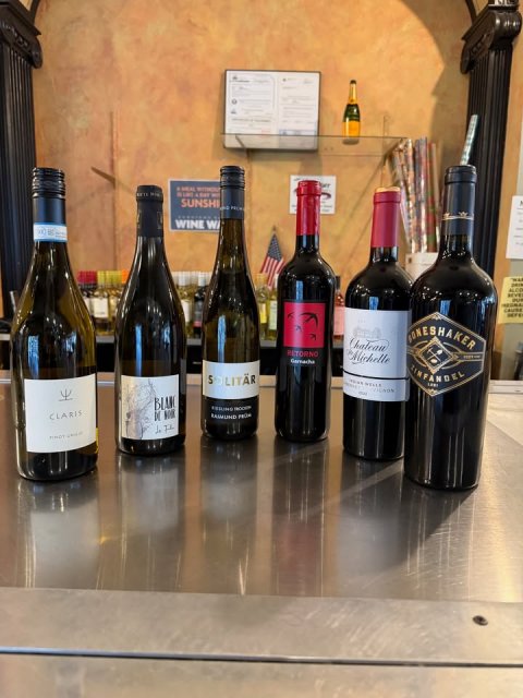 Beverage, Alcohol, Bottle. Text: SUNSHI WINE W ALCO ONESHAKER Michelle CLARIS