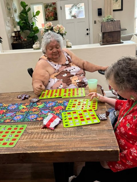 Cup, Person, Table. Text: BINGO