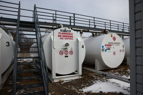 Factory, Gas Pump, Pipeline. Text: JET FUEL FLAMMABLE NO SMOKING NO VAPING 3 4 5