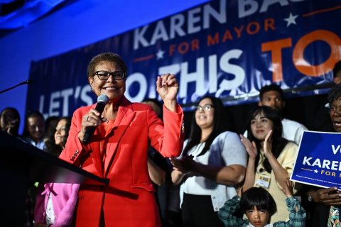 Microphone, Glasses, Crowd. Text: KAREN FOR MAYOR LET'S HIS TO FOR