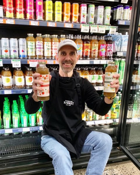 Adult, Man, Person. Text: 2/$6 2/$6 JO TEA 2/$3 COMMON MARKET