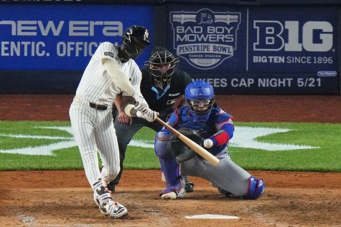 People, Glove, Helmet. Text: NEW Era BAD BOY MOWERS BIG ENTIC. OFFIC PINSTRIPE BOWL BIG TEN SINCE 1896