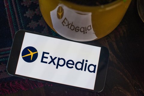 Logo, Mobile Phone, Phone. Text: Expedia