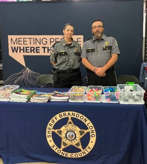 Desk, Person, Police Officer. Text: MEETING PE WHERE TH