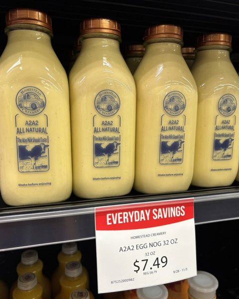 Beverage, Milk, Food. Text: A2A2 A2A2 A2A2 A2A2 ALLNATURAL ALL NATURAL Shake before enjoying EVERYDAY SAVINGS HOMESTEAD CREAMERY A2A2 EGG NOG 32 OZ 32 oz $7.49 875252000982