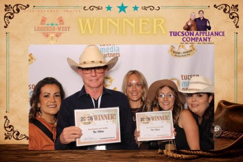 Hat, Man, Person. Text: LEGENDS-WEST WINNER TUCSON APPLIANCE COMPANY media artners tucs 20 26 WINNER!