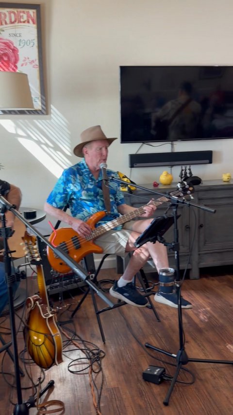 Shoe, Guitar, Person. Text: RDEN SINCE 1905