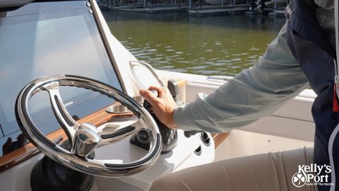 Yacht, Man, Person. Text: Kelly's Port