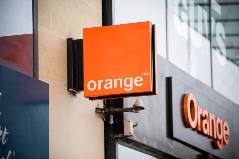 Sign, Symbol, Monitor. Text: TM orange Orange