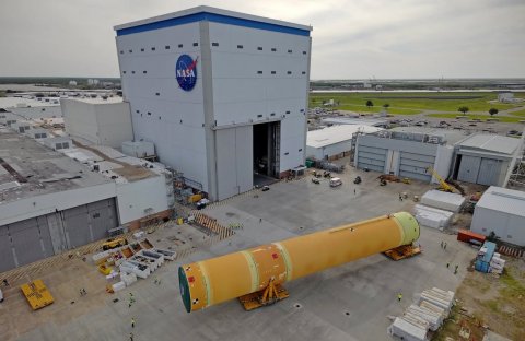 Rocket, Hangar, Car. Text: NASA