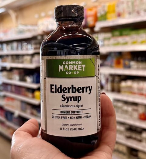 Seasoning, Syrup, Shop. Text: COMMON MARKET Elderberry Syrup (Sambucus nigra) IMMUNE SUPPORT GLUTEN FREE NON GMO VEGAN Dietary Supplement 8 fl oz (240 mL)