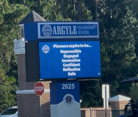 Monitor, Screen, Sign. Text: ARGYLE ELEMENTARY SCHOOL Pioneers aspire to be... Repsonsible Engaged Innovative Confident Reflective Safe 2625 STOP