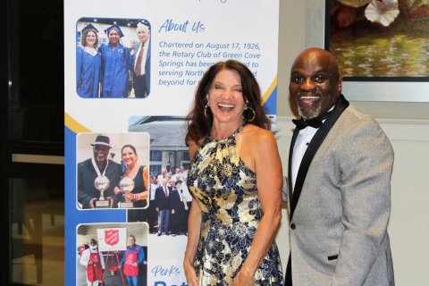 Blazer, Fashion, Formal Wear. Text: About us the Rotary Club of Green Cove Springs has been serving North beyond for
