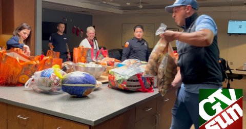 Adult, Person, Woman. Text: GV