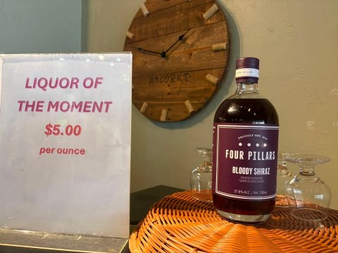 Food, Syrup, Liquor. Text: LIQUOR OF THE MOMENT $5.00 per ounce FOUR PILLARS BLOODY SHIRAZ