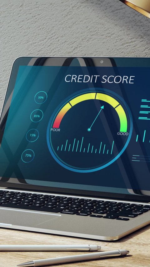 Pen, Laptop, Screen. Text: CREDIT SCORE 50% 85% GOOD POOR 15% 75%