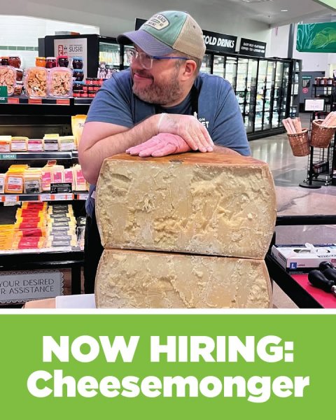 Adult, Man, Person. Text: OLD DRINKS SUSHI ON ET R ASSISTANCE NOW HIRING: Cheesemonger