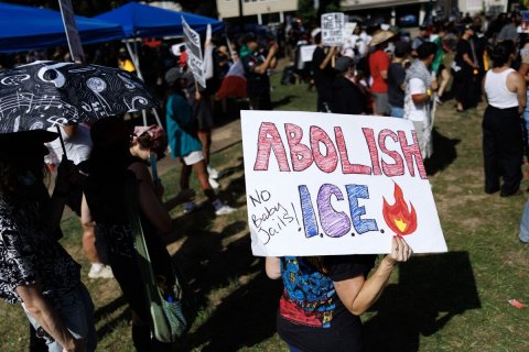 Protest, People, Shoe. Text: ABOLISH ICE