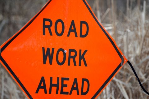 Sign, Symbol, Road Sign. Text: ROAD WORK AHEAD