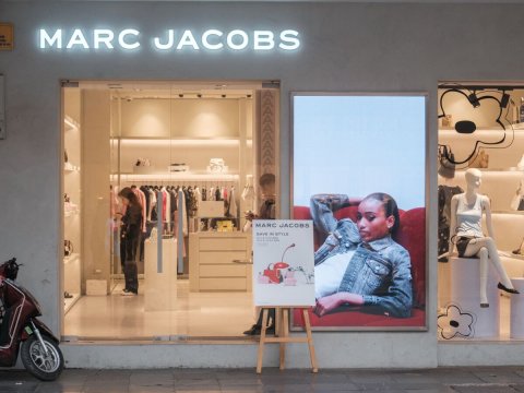 Adult, Person, Woman. Text: MARC JACOBS