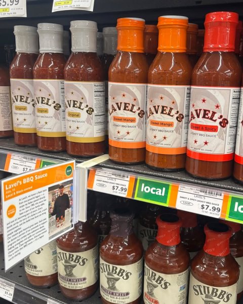 Ketchup, Person, Shop. Text: VEL'S Original Original Original AVEL'S Lavel's BBQ Sauce $7.99 local