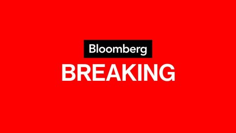 Logo, First Aid, Text. Text: Bloomberg BREAKING