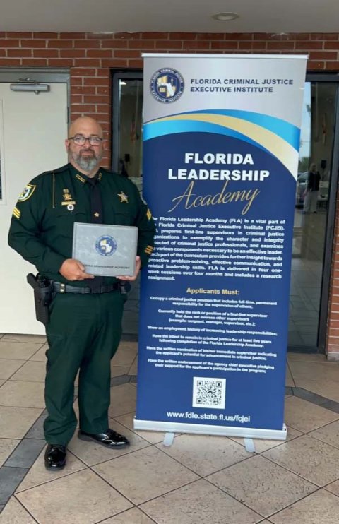 Adult, Man, Person. Text: FLORIDA CRIMINAL JUSTICE EXECUTIVE INSTITUTE FLORIDA LEADERSHIP Academy Florida Criminal Justice Executive Institute (FCJEB prepares first-line supervisors in criminal justice sected of criminal justice professionals, and examines Applicants Must: