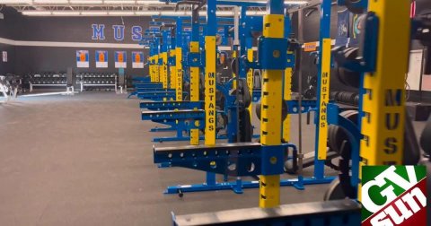 Factory, Bulldozer, Gym. Text: MUS MUSTANGS MUSTANGS MUS GV