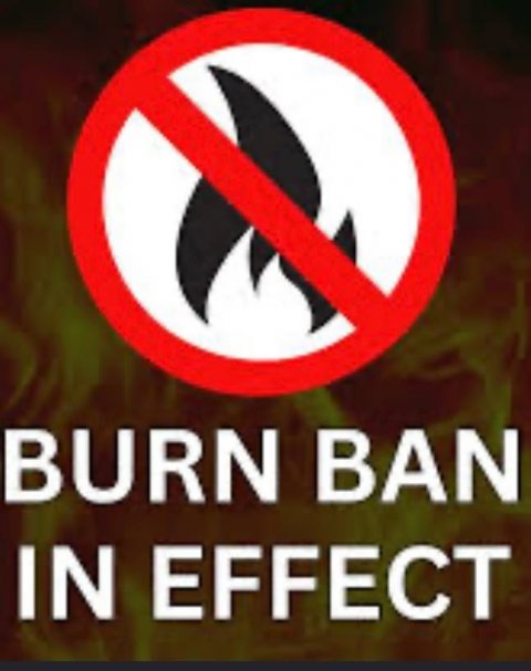 Sign, Symbol, Road Sign. Text: BURN BAN IN EFFECT