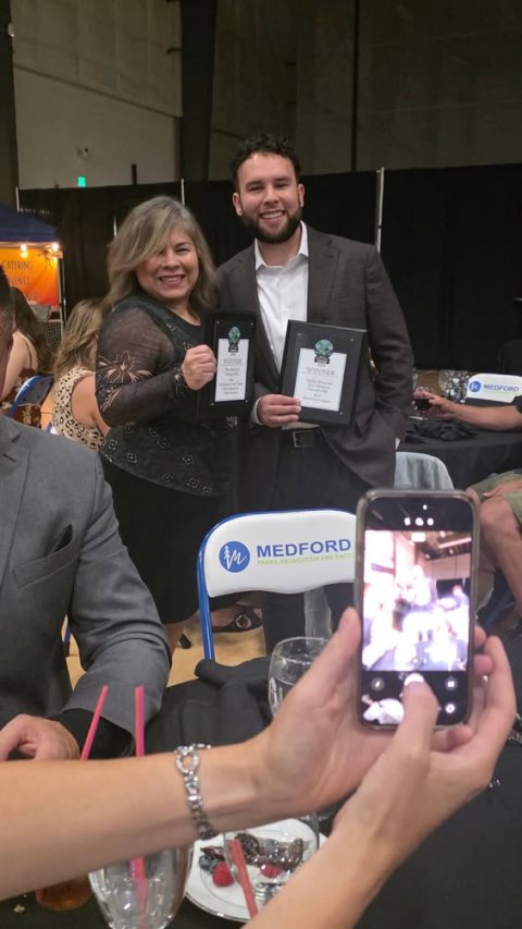 Phone, Person, Woman. Text: MEDFORD MEDFORD
