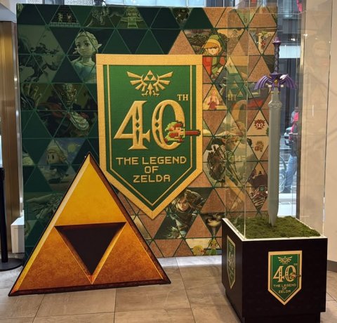 Person, Crowd, Indoors. Text: TH 40 THE LEGEND OF ZELDA 40