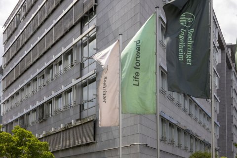 City, Flag, Office Building. Text: Boehringer Ingelheim Life forward Roehringer