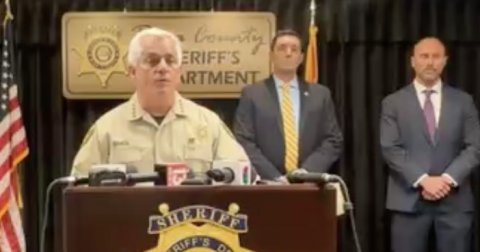 Crowd, Press Conference, Tie. Text: ERIFF'S RIFF'S