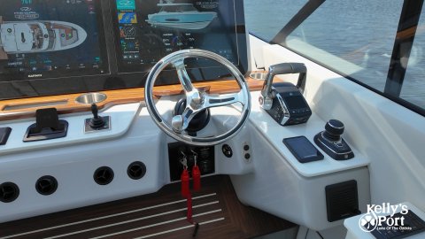 Vehicle, Yacht, Wheel. Text: Kelly's Port