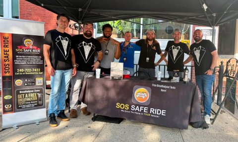 People, Person, Pants. Text: 240-722-7422 SOS SAFE RIDE GET A FREE SOS SAFE RIDE