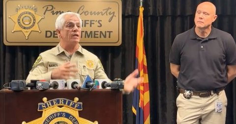 Crowd, Person, Press Conference. Text: Pim County DE TMENT SHERIFF